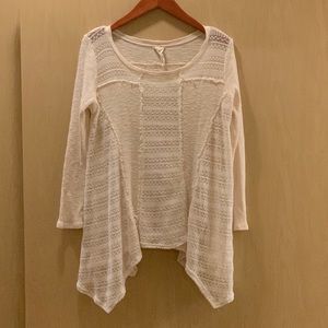 Cream sweater with 3/4 inch sleeves.